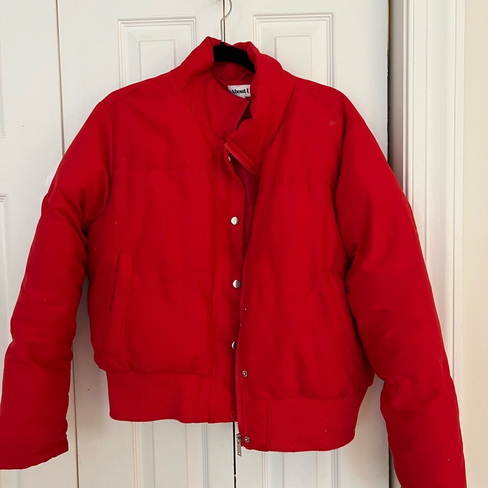 Red Puffer Jacket - About Us